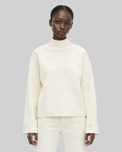 White mock-neck sweater