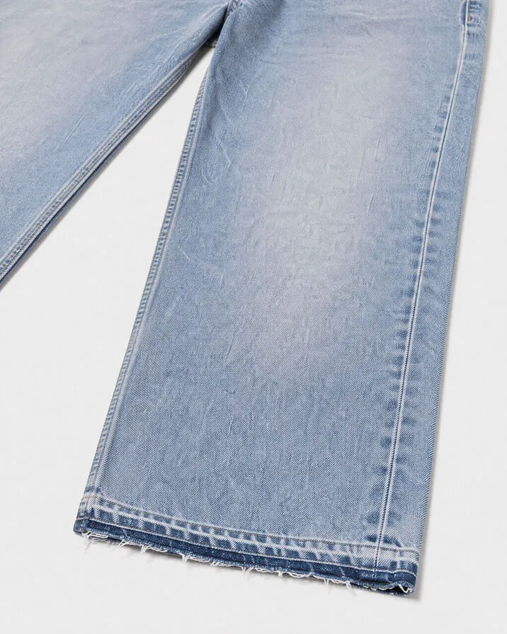 Light blue straight-leg jeans with raw-edge hems