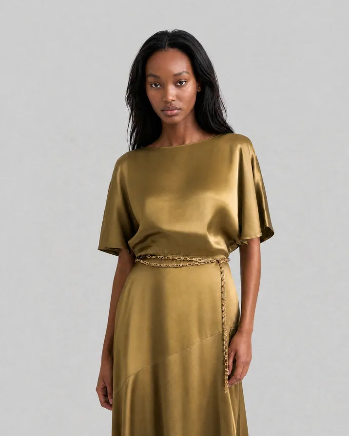 Long satin dress with an olive-colored gold chain